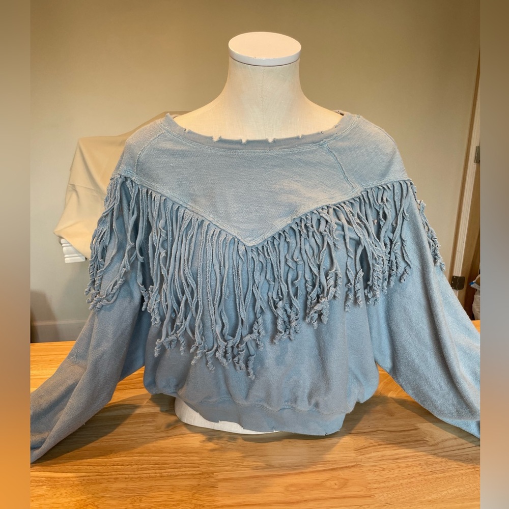 Distressed fringe sweater